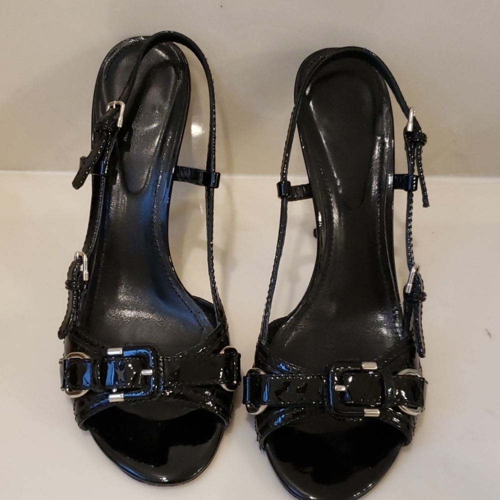 Burberry quilted buckled heels.